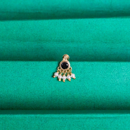 Silver nosepins featuring traditional motifs with a modern design twist, displayed on a neutral background.