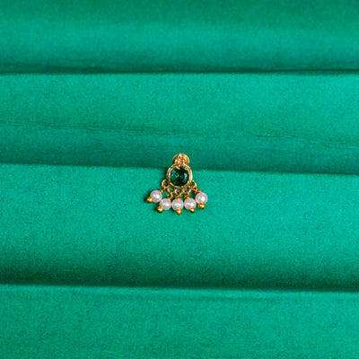 Silver nosepins featuring traditional motifs with a modern design twist, displayed on a neutral background.