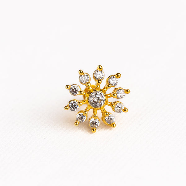 Silver nosepins featuring traditional motifs with a modern design twist, displayed on a neutral background.