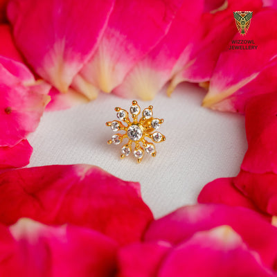 Silver nosepins featuring traditional motifs with a modern design twist, displayed on a neutral background.