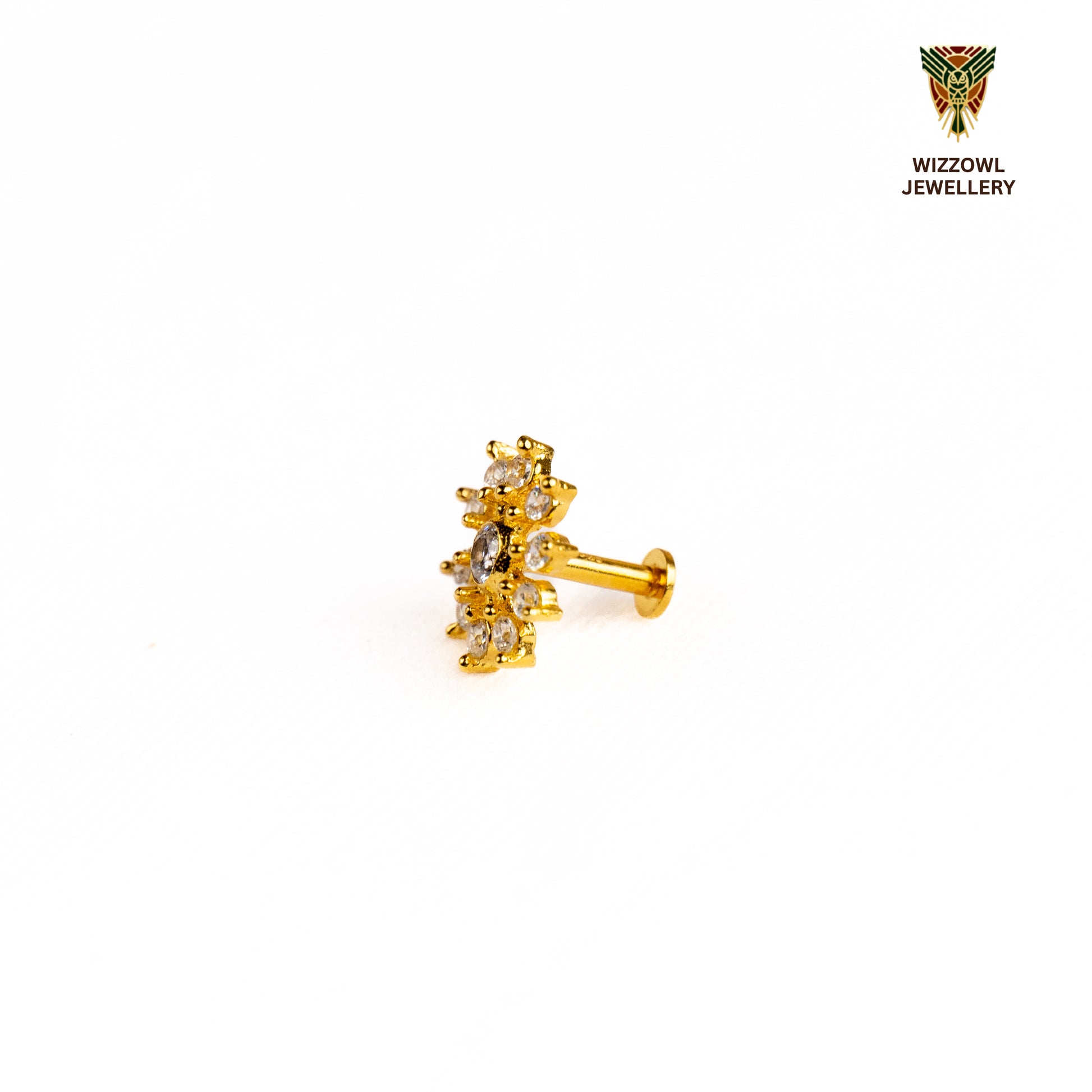 Silver nosepins featuring traditional motifs with a modern design twist, displayed on a neutral background.