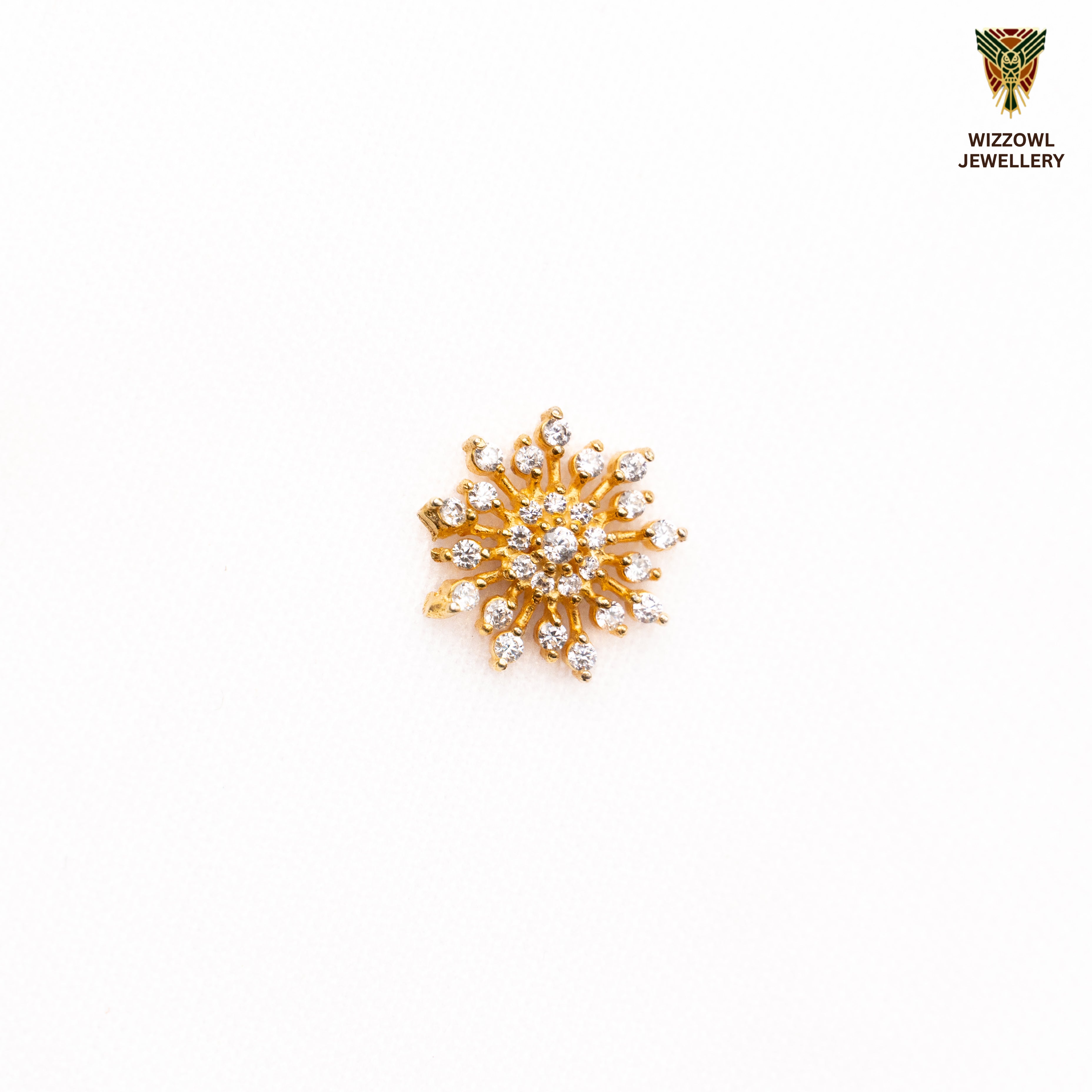 Silver nosepins featuring traditional motifs with a modern design twist, displayed on a neutral background.
