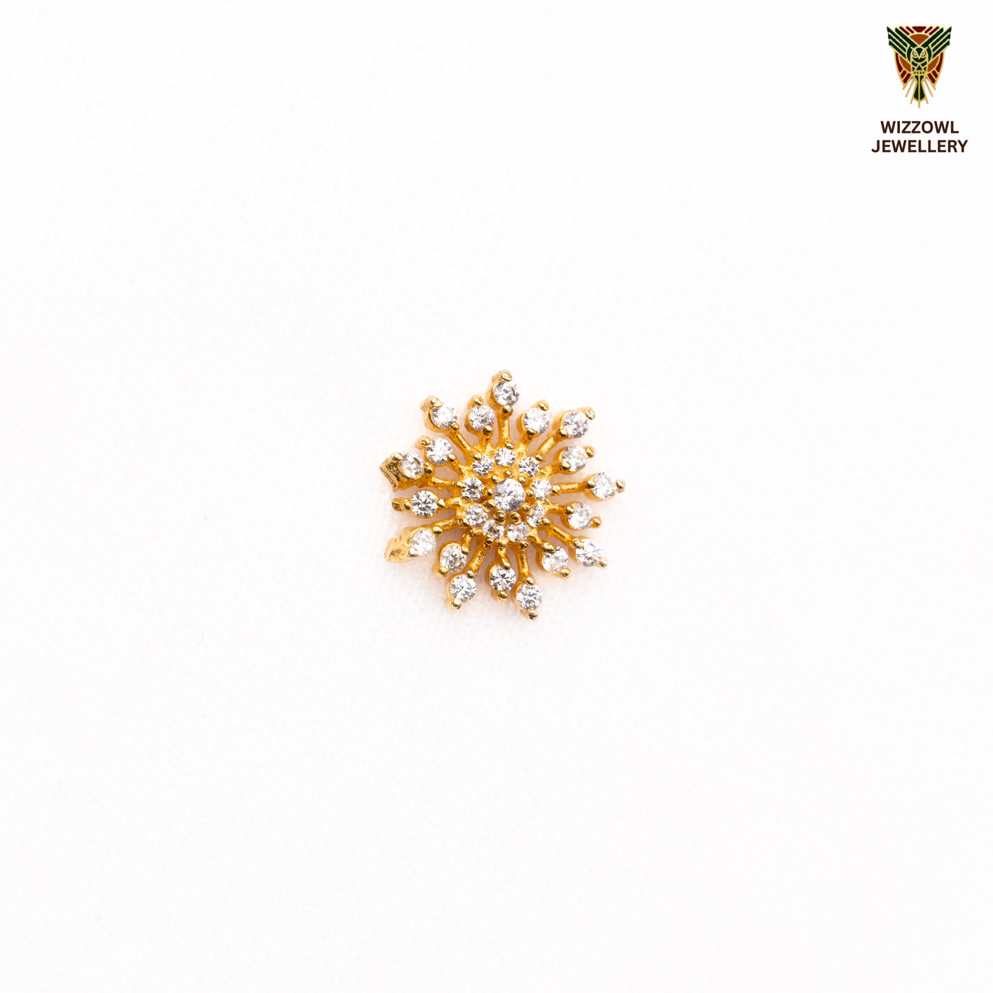 Silver nosepins featuring traditional motifs with a modern design twist, displayed on a neutral background.