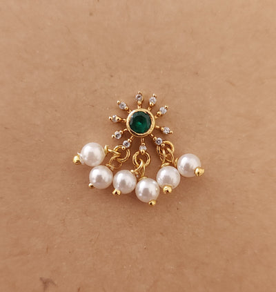 Silver nosepins featuring traditional motifs with a modern design twist, displayed on a neutral background.