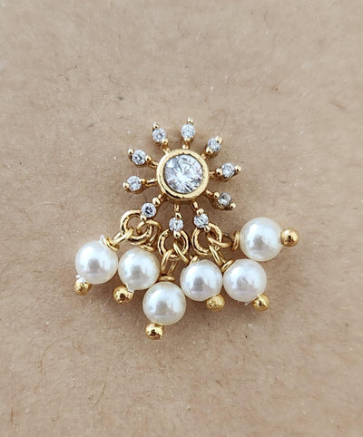 Silver nosepins featuring traditional motifs with a modern design twist, displayed on a neutral background.