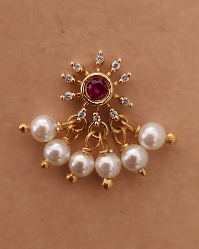 Silver nosepins featuring traditional motifs with a modern design twist, displayed on a neutral background.