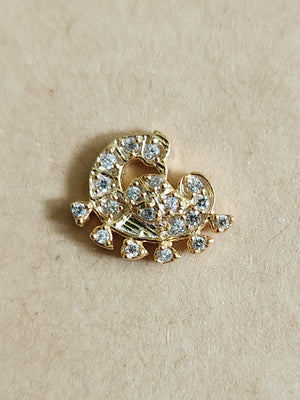 Silver nosepins featuring traditional motifs with a modern design twist, displayed on a neutral background.