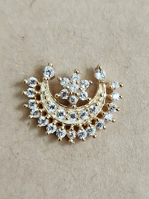 Silver nosepins featuring traditional motifs with a modern design twist, displayed on a neutral background.