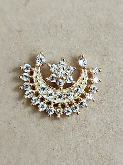 Silver nosepins featuring traditional motifs with a modern design twist, displayed on a neutral background.