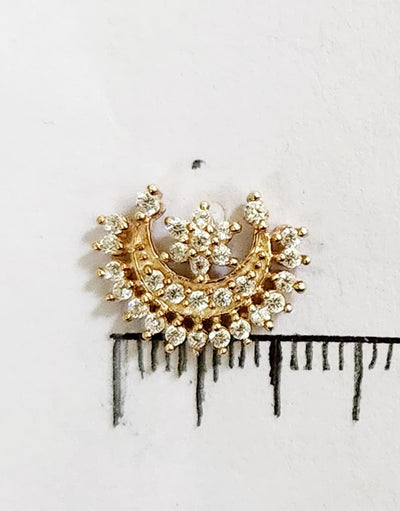 Silver nosepins featuring traditional motifs with a modern design twist, displayed on a neutral background.