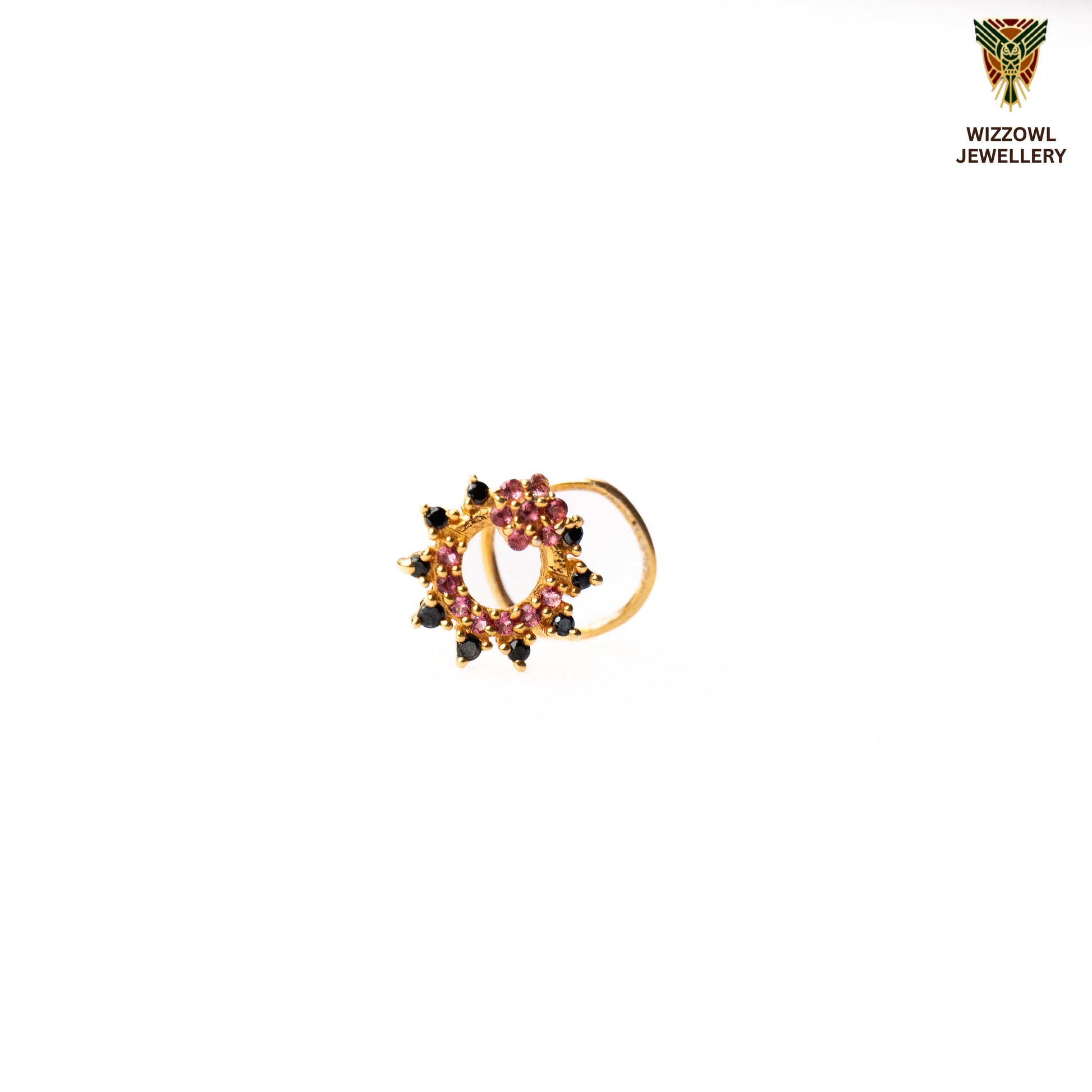 Silver nosepins featuring traditional motifs with a modern design twist, displayed on a neutral background.