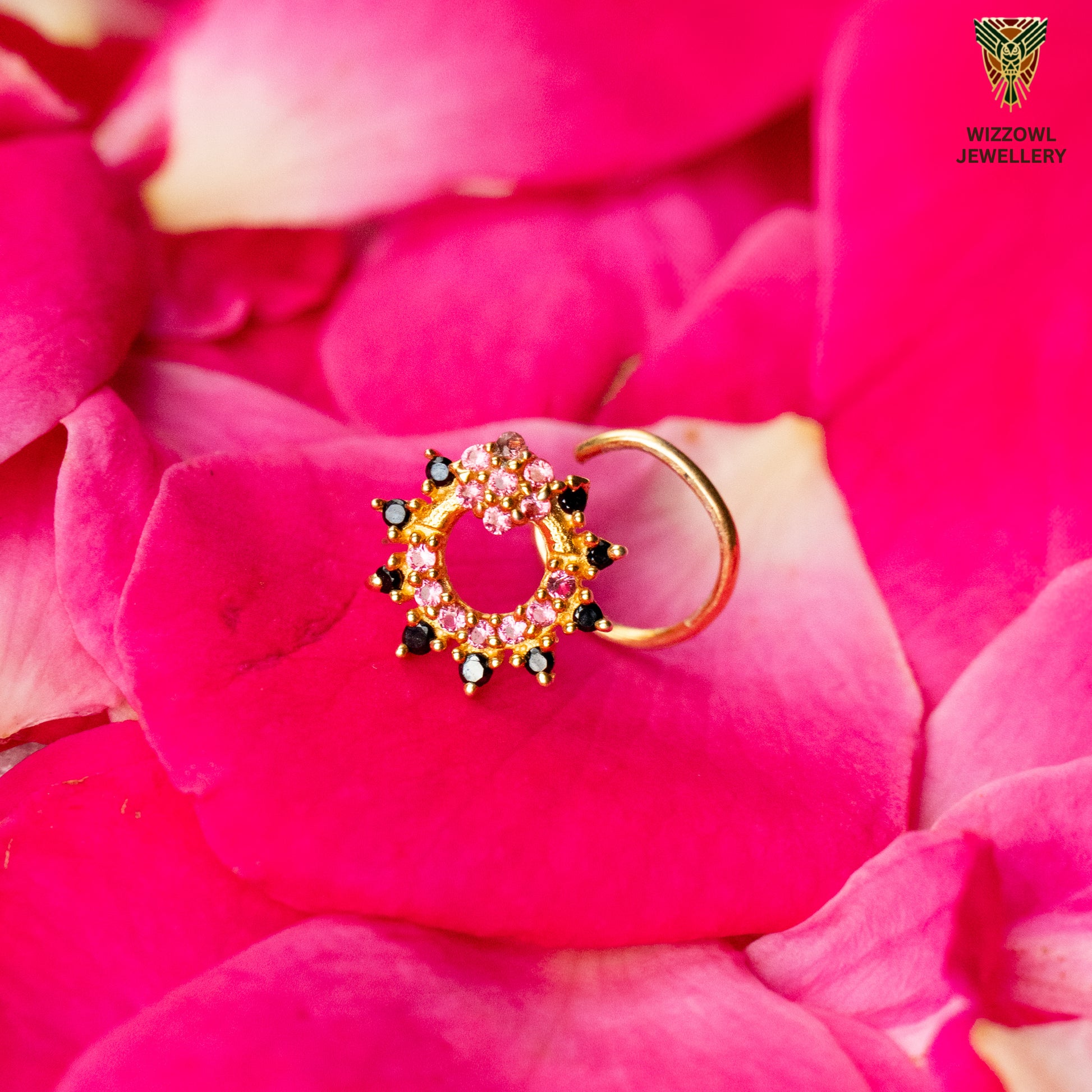 Silver nosepins featuring traditional motifs with a modern design twist, displayed on a neutral background.