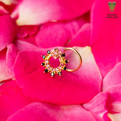 Silver nosepins featuring traditional motifs with a modern design twist, displayed on a neutral background.