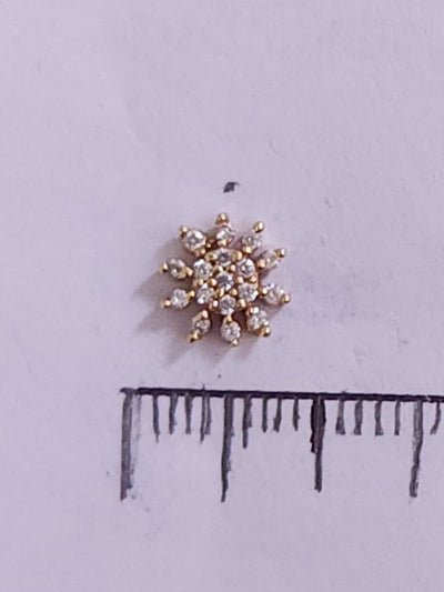 Silver nosepins featuring traditional motifs with a modern design twist, displayed on a neutral background.