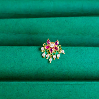 Silver nosepins featuring traditional motifs with a modern design twist, displayed on a neutral background.