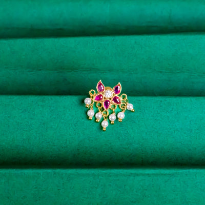 Silver nosepins featuring traditional motifs with a modern design twist, displayed on a neutral background.