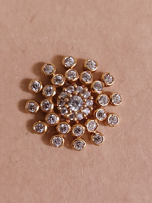 Silver nosepins featuring traditional motifs with a modern design twist, displayed on a neutral background.