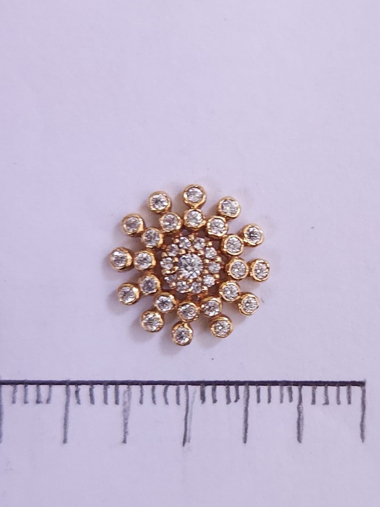 Silver nosepins featuring traditional motifs with a modern design twist, displayed on a neutral background.