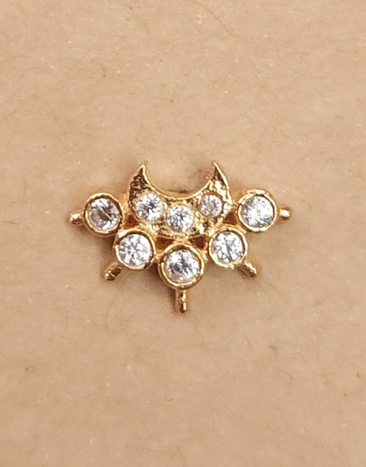 Silver nosepins featuring traditional motifs with a modern design twist, displayed on a neutral background.