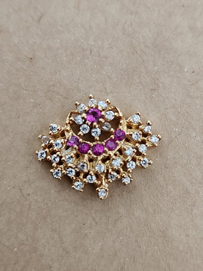 Silver nosepins featuring traditional motifs with a modern design twist, displayed on a neutral background.