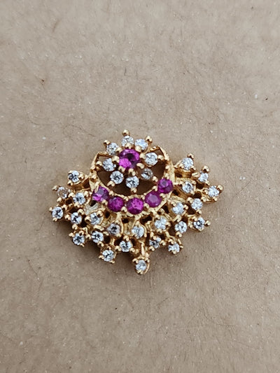 Silver nosepins featuring traditional motifs with a modern design twist, displayed on a neutral background.
