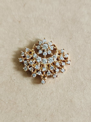 Silver nosepins featuring traditional motifs with a modern design twist, displayed on a neutral background.