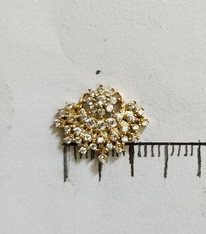 Silver nosepins featuring traditional motifs with a modern design twist, displayed on a neutral background.