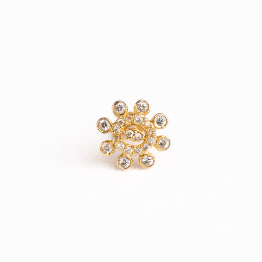 Silver nosepins featuring traditional motifs with a modern design twist, displayed on a neutral background.