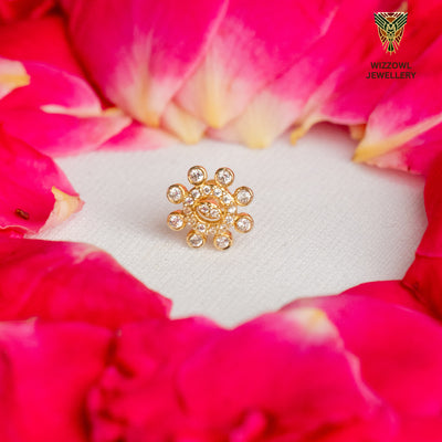 Silver nosepins featuring traditional motifs with a modern design twist, displayed on a neutral background.