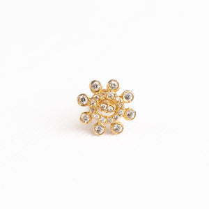Silver nosepins featuring traditional motifs with a modern design twist, displayed on a neutral background.
