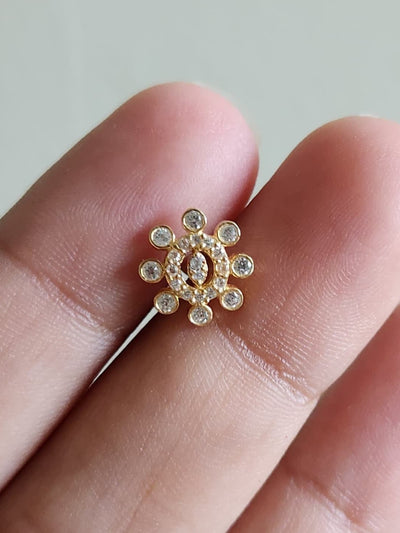 Silver nosepins featuring traditional motifs with a modern design twist, displayed on a neutral background.
