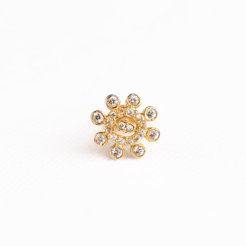 Silver nosepins featuring traditional motifs with a modern design twist, displayed on a neutral background.