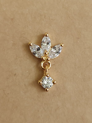 Silver nosepins featuring traditional motifs with a modern design twist, displayed on a neutral background.