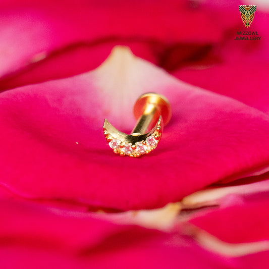 Silver nosepins featuring traditional motifs with a modern design twist, displayed on a neutral background.