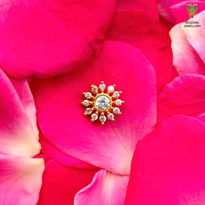 Silver nosepins featuring traditional motifs with a modern design twist, displayed on a neutral background.