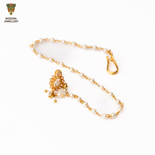Silver nosepins featuring traditional motifs with a modern design twist, displayed on a neutral background.