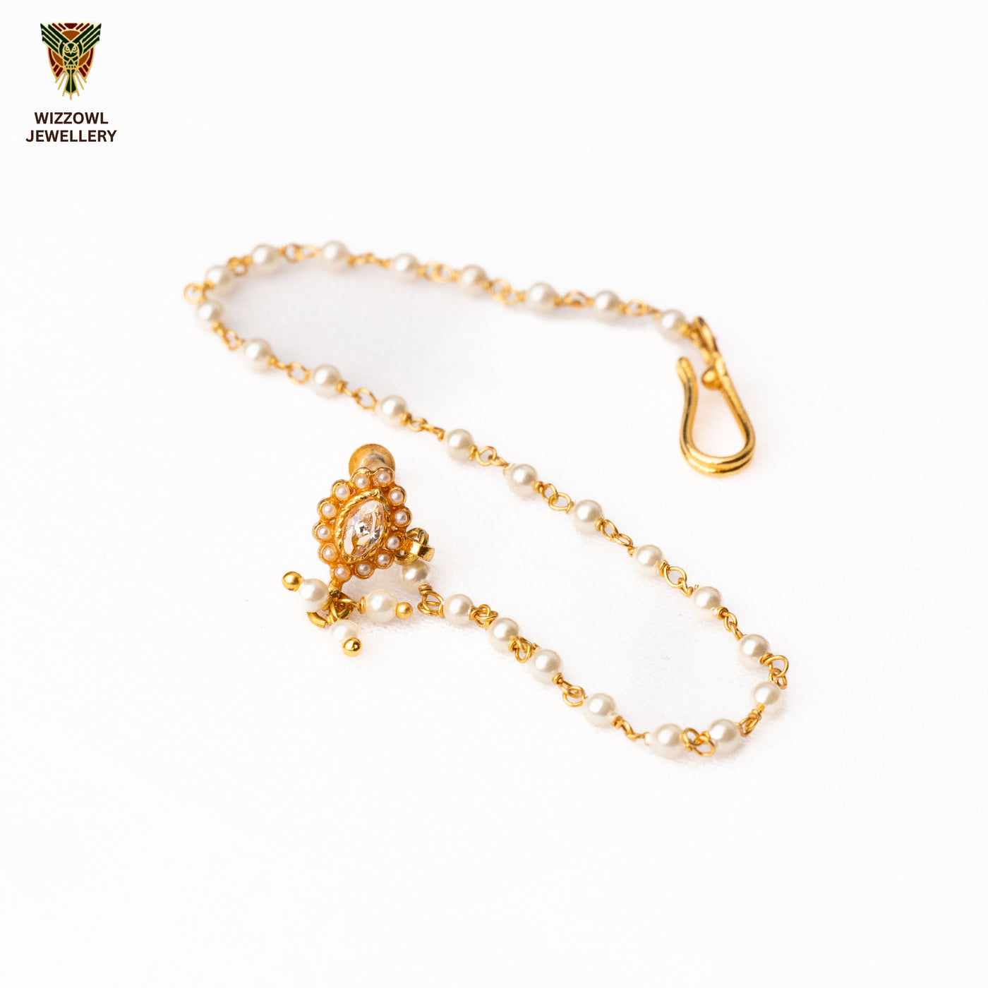 Silver nosepins featuring traditional motifs with a modern design twist, displayed on a neutral background.