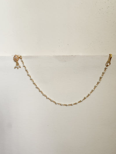 Silver nosepins featuring traditional motifs with a modern design twist, displayed on a neutral background.