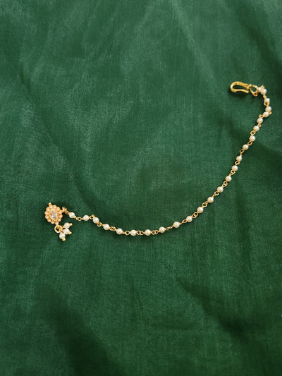 Silver nosepins featuring traditional motifs with a modern design twist, displayed on a neutral background.