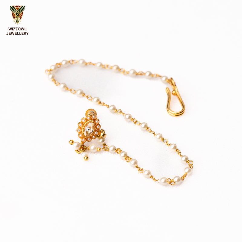 Silver nosepins featuring traditional motifs with a modern design twist, displayed on a neutral background.