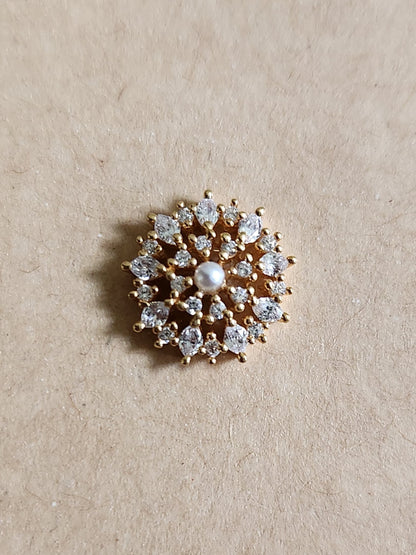 Silver nosepins featuring traditional motifs with a modern design twist, displayed on a neutral background.