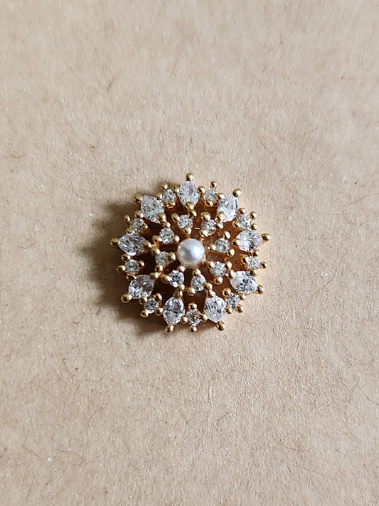 Silver nosepins featuring traditional motifs with a modern design twist, displayed on a neutral background.