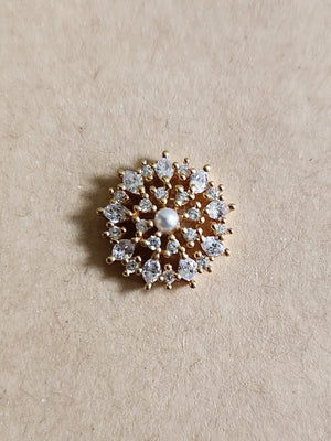 Silver nosepins featuring traditional motifs with a modern design twist, displayed on a neutral background.