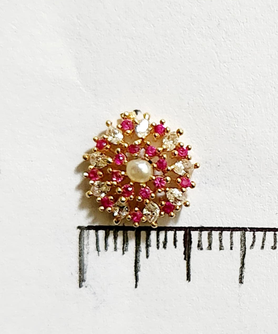 Silver nosepins featuring traditional motifs with a modern design twist, displayed on a neutral background.