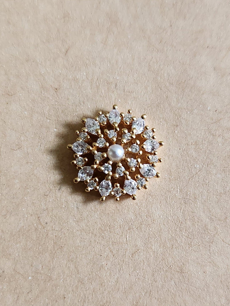 Silver nosepins featuring traditional motifs with a modern design twist, displayed on a neutral background.