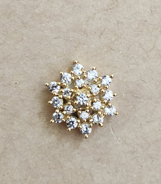 Silver nosepins featuring traditional motifs with a modern design twist, displayed on a neutral background.
