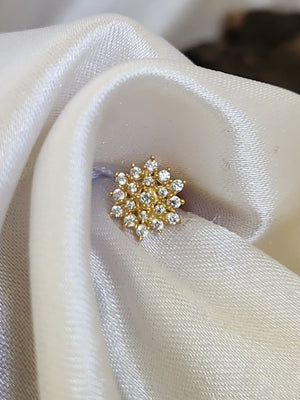 Silver nosepins featuring traditional motifs with a modern design twist, displayed on a neutral background.