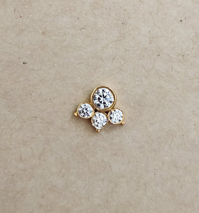 Silver nosepins featuring traditional motifs with a modern design twist, displayed on a neutral background.