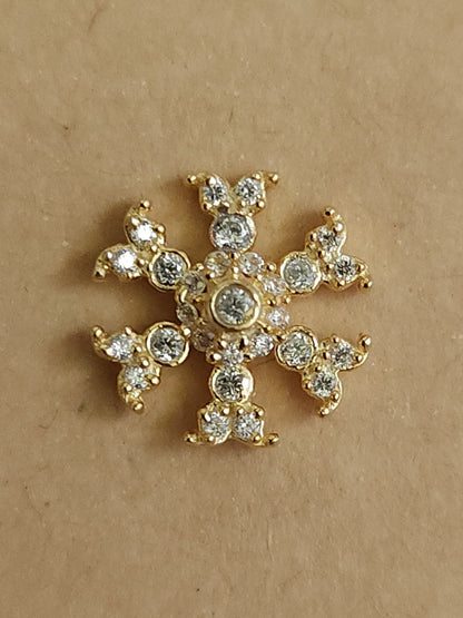 Silver nosepins featuring traditional motifs with a modern design twist, displayed on a neutral background.