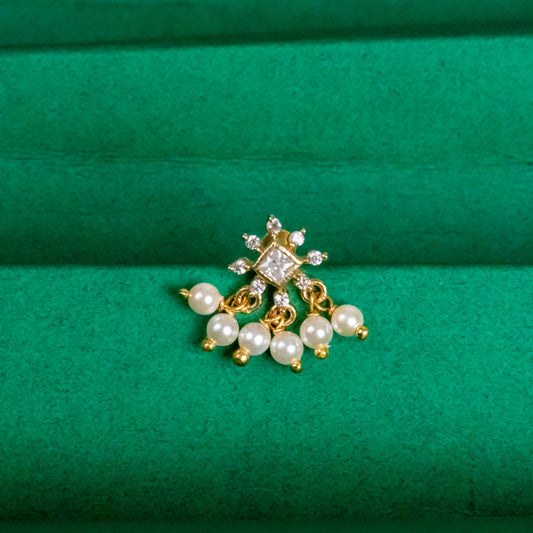 Silver nosepins featuring traditional motifs with a modern design twist, displayed on a neutral background.